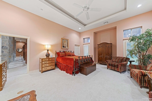 26118 Alto Oaks, San Antonio, TX 78255 - bedroom with light carpet, a high ceiling, a raised ceiling, baseboards, and recessed lighting