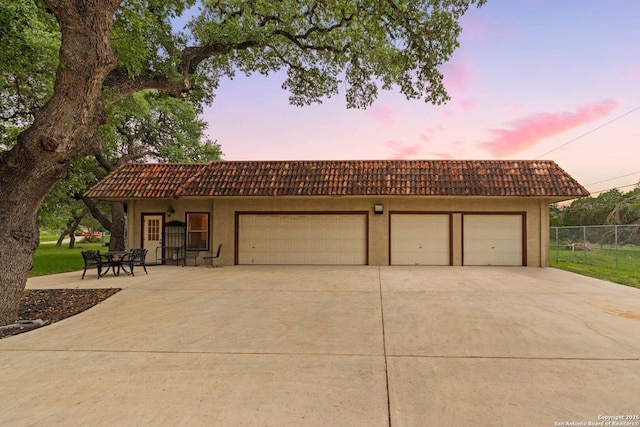 26118 Alto Oaks, San Antonio, TX 78255 - view of front facade featuring a tiled roof, fence, concrete driveway, and stucco siding