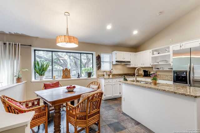 kitchen with an island with sink, a sink, open shelves, white cabinetry, and under cabinet range hood