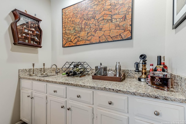 bar featuring bar and a sink
