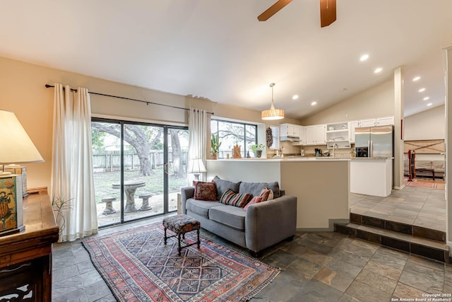 living room with recessed lighting, lofted ceiling, ceiling fan, and stone tile floors