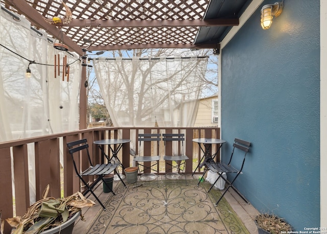 balcony featuring a pergola