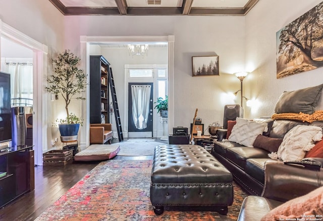 living room with coffered ceiling, visible vents, beamed ceiling, a chandelier, and hardwood / wood-style flooring