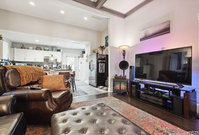 living area featuring recessed lighting and wood finished floors