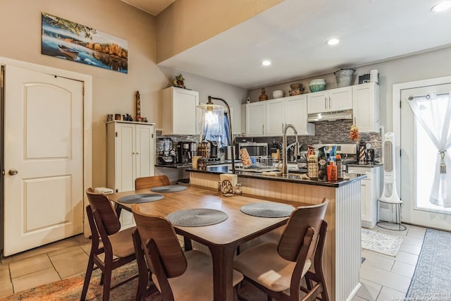 dining room featuring light tile patterned floors and recessed lighting