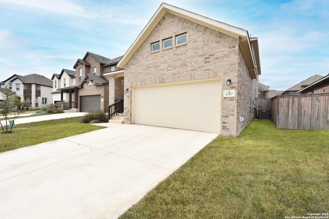 1707 Lawnside, San Antonio, TX 78245 - view of front of house featuring fence, a front lawn, brick siding, and driveway