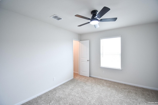 1707 Lawnside, San Antonio, TX 78245 - spare room with ceiling fan, light carpet, baseboards, and visible vents