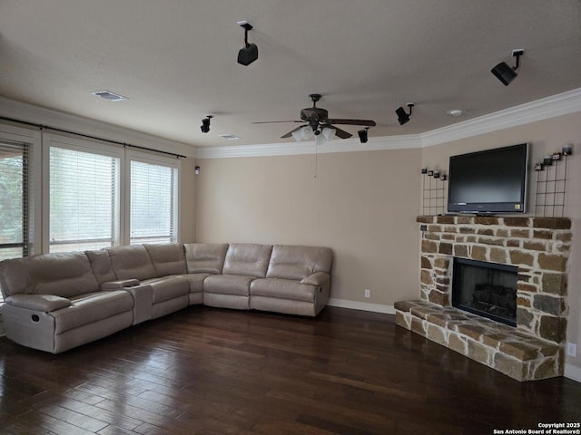 living area with ceiling fan, crown molding, visible vents, and wood-type flooring