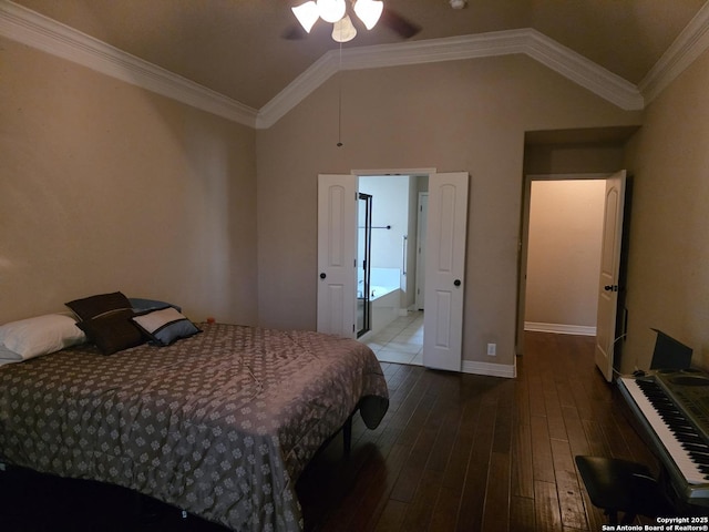 bedroom featuring vaulted ceiling, ornamental molding, baseboards, and wood finished floors