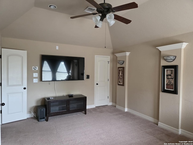 carpeted living area featuring lofted ceiling, baseboards, a ceiling fan, and visible vents