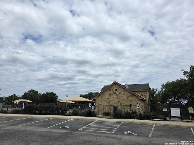 uncovered parking lot with fence