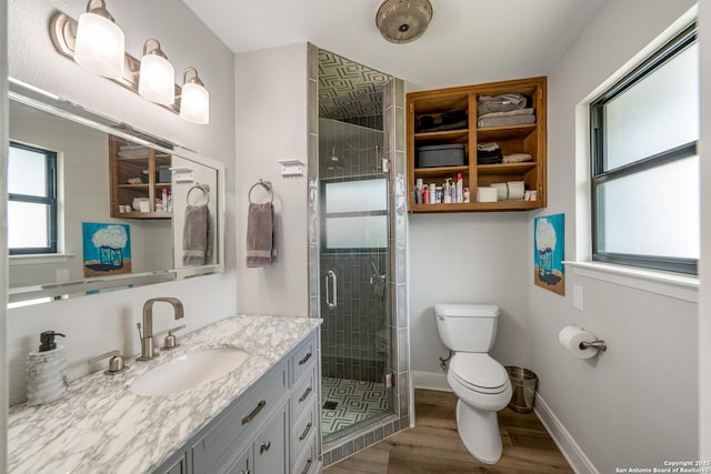 1397 Desert Gold, Boerne, TX 78006 - bathroom featuring toilet, vanity, wood finished floors, a shower stall, and baseboards