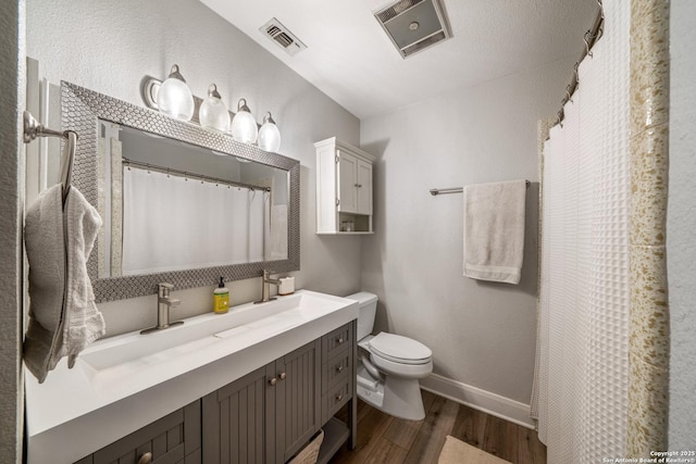 1397 Desert Gold, Boerne, TX 78006 - full bath featuring wood finished floors, toilet, baseboards, vanity, and a shower with curtain