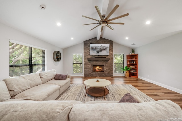 1397 Desert Gold, Boerne, TX 78006 - living room with healthy amount of natural light, wood finished floors, a stone fireplace, ceiling fan, and recessed lighting