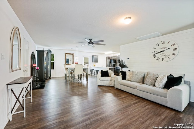 4902 Everett Loop, Converse, TX 78109 - living room featuring dark wood-style flooring, a ceiling fan, and visible vents