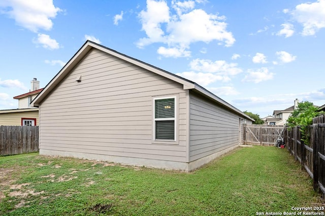 4902 Everett Loop, Converse, TX 78109 - view of side of home featuring a fenced backyard and a yard
