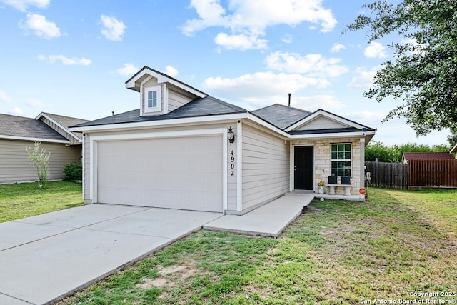 4902 Everett Loop, Converse, TX 78109 - view of front of home featuring an attached garage, concrete driveway, fence, and a front yard