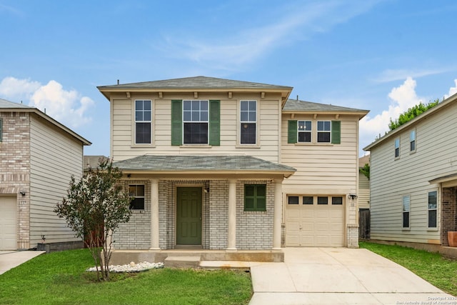 traditional-style house featuring covered porch, an attached garage, brick siding, concrete driveway, and a front lawn