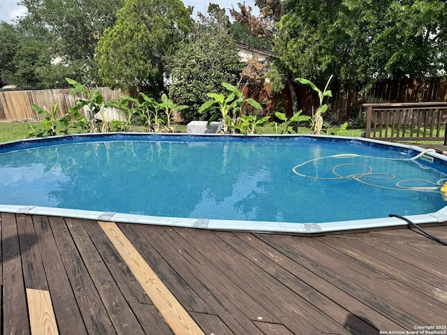 6603 Meadow Fawn, Converse, TX 78109 - view of swimming pool with a deck, a fenced in pool, and a fenced backyard