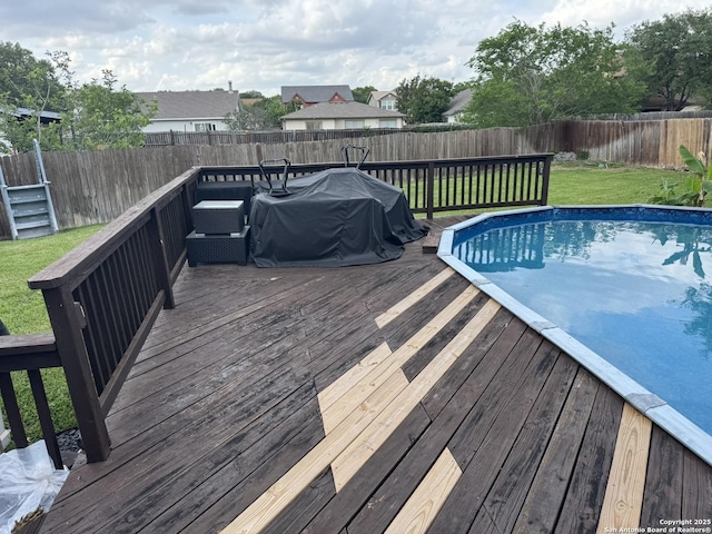 6603 Meadow Fawn, Converse, TX 78109 - view of swimming pool with a fenced backyard, a deck, and a lawn