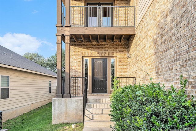 1819 Gray Fox Crk, San Antonio, TX 78245 - doorway to property featuring brick siding and a balcony