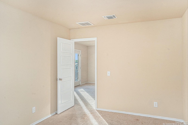 1819 Gray Fox Crk, San Antonio, TX 78245 - unfurnished room with baseboards, light carpet, and visible vents
