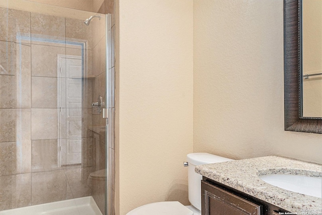 1819 Gray Fox Crk, San Antonio, TX 78245 - full bath featuring a stall shower, vanity, toilet, and a textured wall