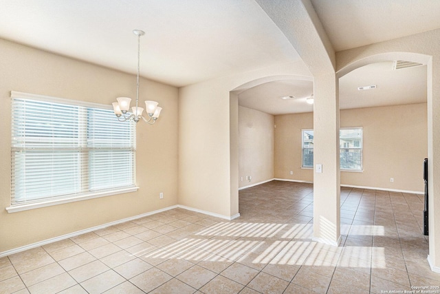 1819 Gray Fox Crk, San Antonio, TX 78245 - tiled spare room with arched walkways, baseboards, an inviting chandelier, and visible vents