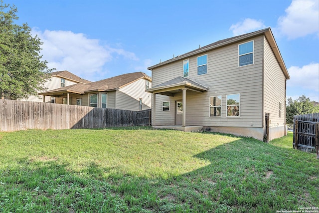 1819 Gray Fox Crk, San Antonio, TX 78245 - rear view of property featuring a yard and a fenced backyard