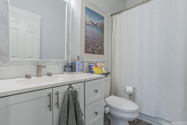full bath with vanity and toilet