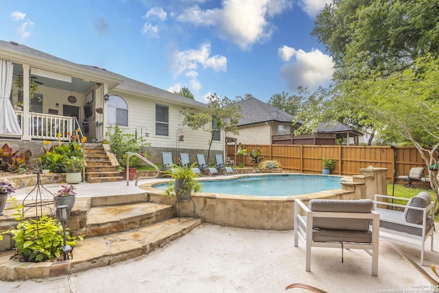 view of pool featuring stairway, a fenced backyard, and a patio