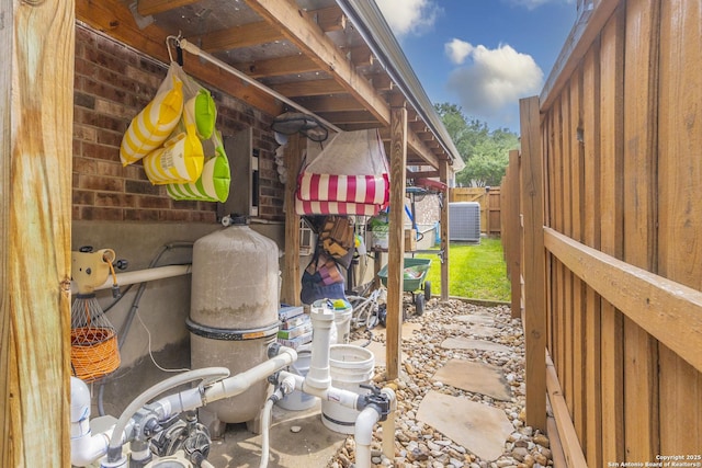 view of patio / terrace featuring cooling unit and fence