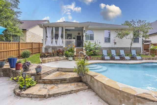 back of house featuring a fenced backyard and a patio area