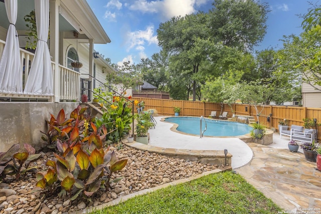 view of pool with a patio and a fenced backyard
