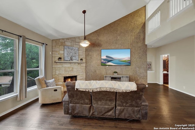 living room with a fireplace, baseboards, high vaulted ceiling, and dark wood finished floors