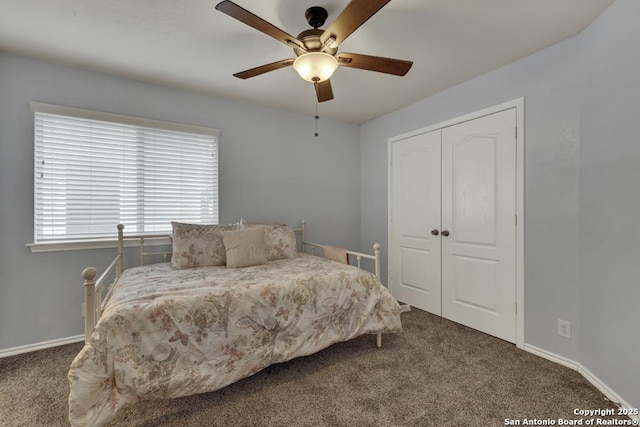 bedroom featuring baseboards, a closet, a ceiling fan, and carpet floors