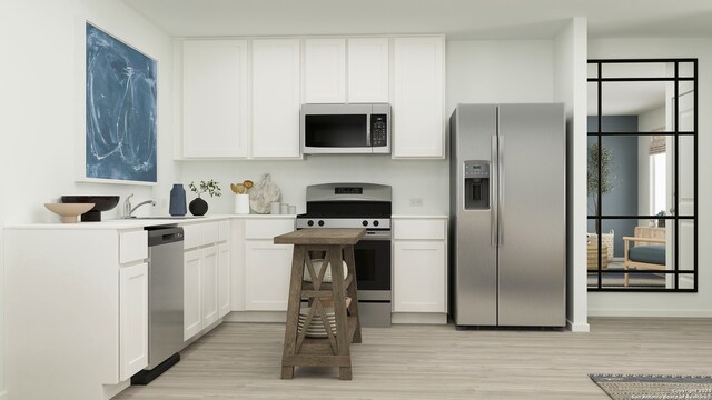 2818 Carnelian Trl, San Antonio, TX 78264 - kitchen with white cabinetry, stainless steel appliances, and light wood-style floors