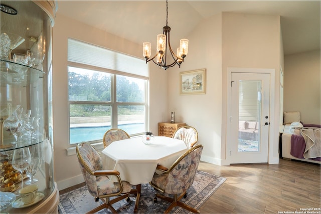 1587 Lakeshore Dr, Canyon Lake, TX 78133 - dining room featuring a chandelier, wood finished floors, and baseboards
