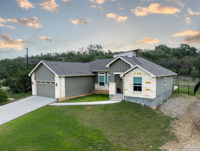 1587 Lakeshore Dr, Canyon Lake, TX 78133 - view of front of property featuring board and batten siding, stone siding, roof with shingles, concrete driveway, and a garage