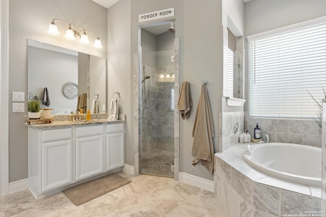 full bath featuring marble finish floor, vanity, a shower stall, baseboards, and a bath