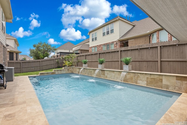 view of swimming pool featuring a patio, a fenced in pool, and a fenced backyard