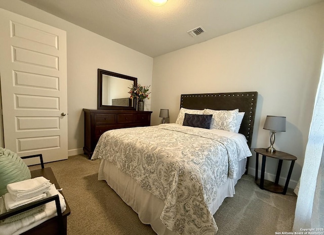 bedroom featuring carpet, baseboards, and visible vents