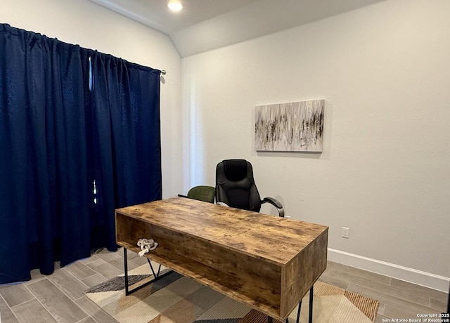 home office with baseboards, recessed lighting, wood finish floors, and vaulted ceiling