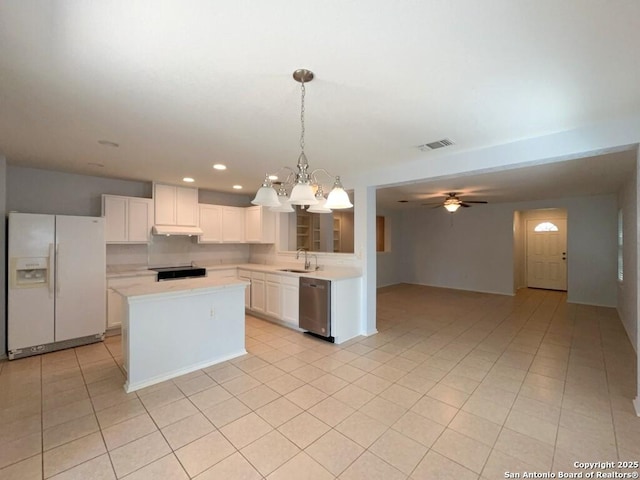 kitchen featuring a sink, visible vents, light countertops, white refrigerator with ice dispenser, and stainless steel dishwasher