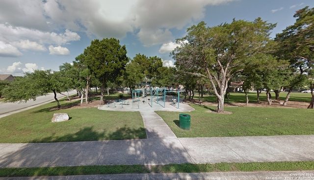 surrounding community featuring a yard and playground community