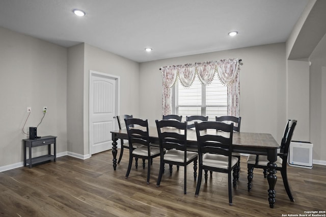 dining room featuring dark wood finished floors, baseboards, and recessed lighting