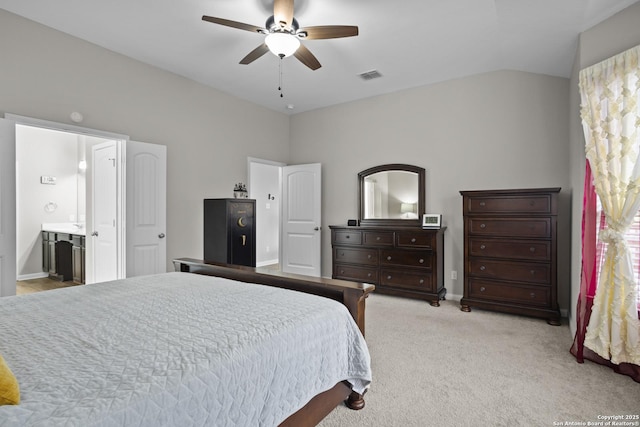 bedroom with light colored carpet, visible vents, vaulted ceiling, ceiling fan, and baseboards