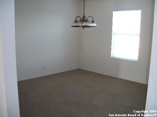 3430 Longhorn, San Antonio, TX 78261 - carpeted spare room with an inviting chandelier