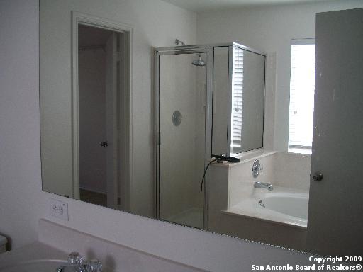 3430 Longhorn, San Antonio, TX 78261 - bathroom with a stall shower, a wealth of natural light, and a bath