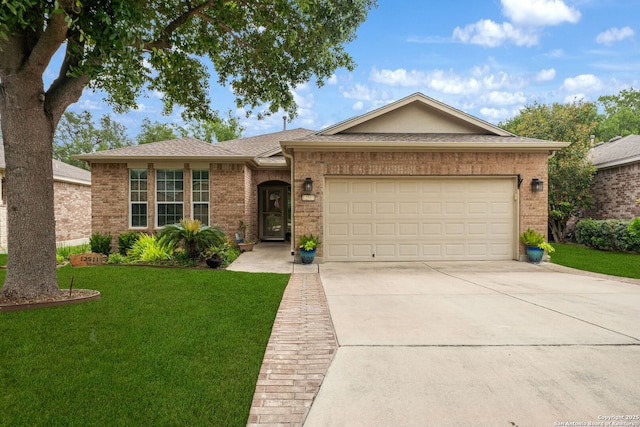 ranch-style home with concrete driveway, an attached garage, a front lawn, and brick siding